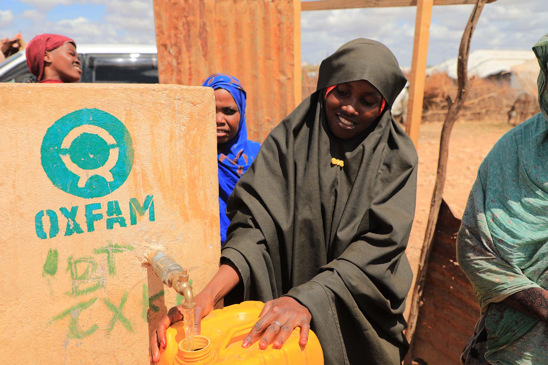 Program participant collecting water (Somalia)