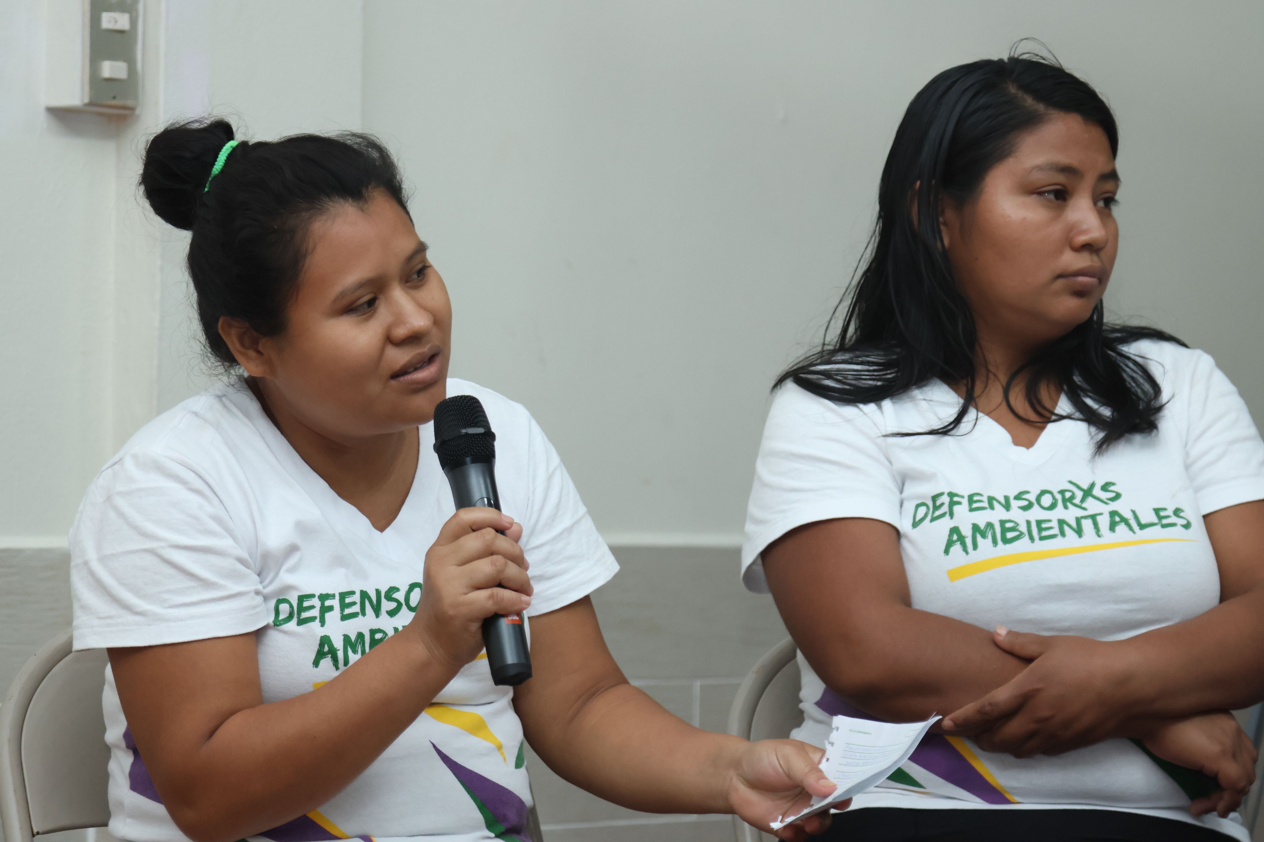 Youth activist speaking into microphone